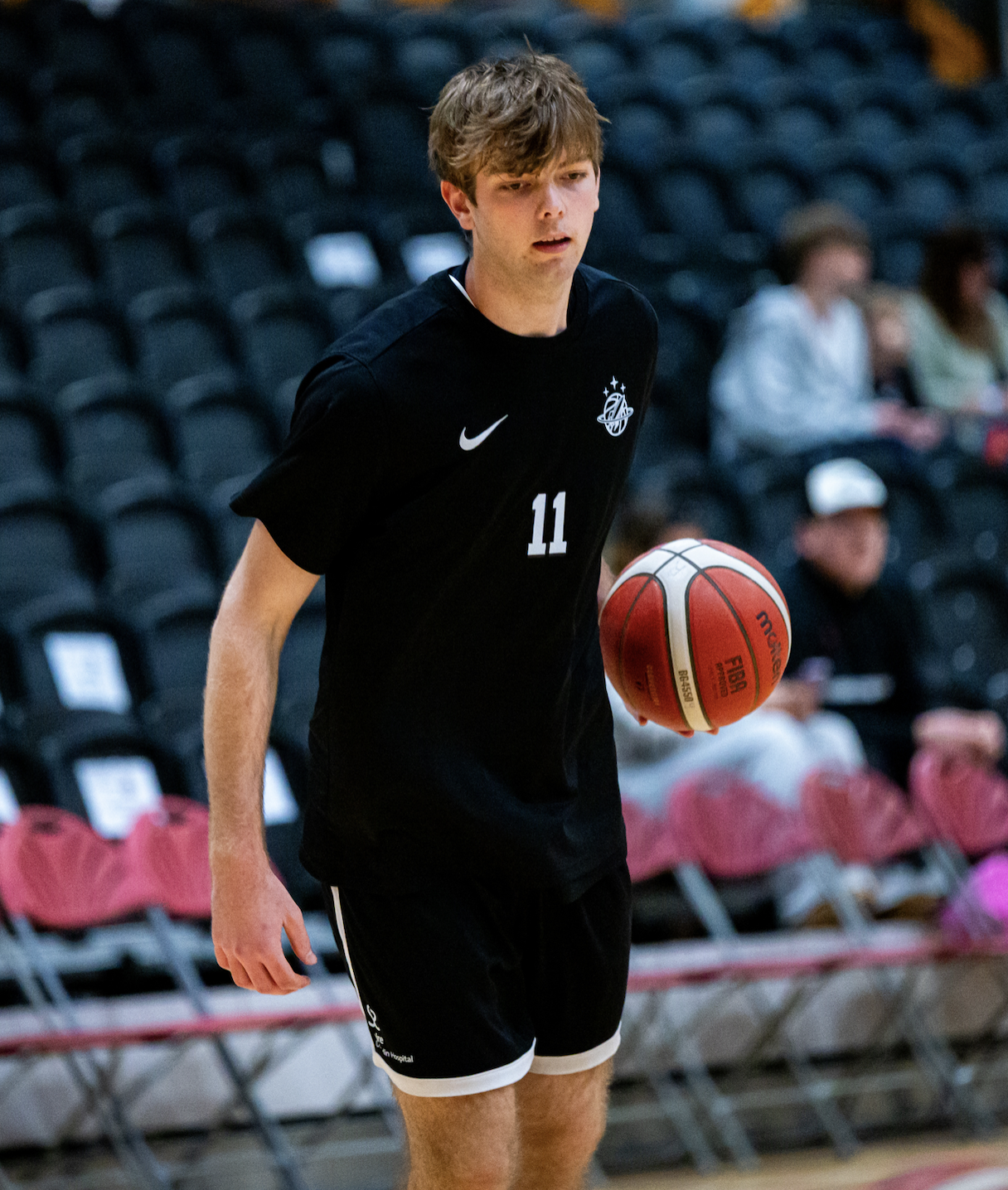 Picture of Simon Chamberlain holding a basketball