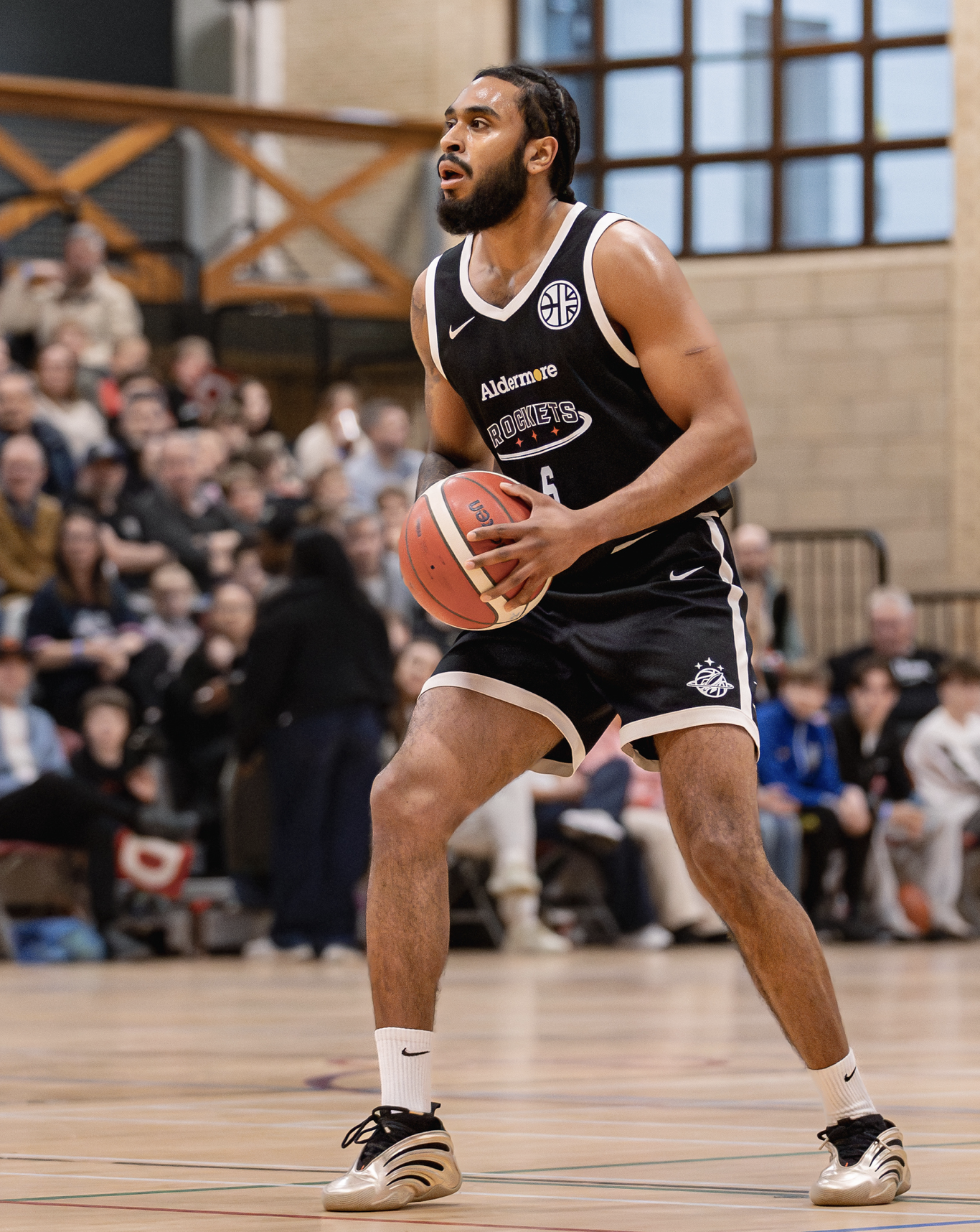 Picture of Zain Poorman with a basketball